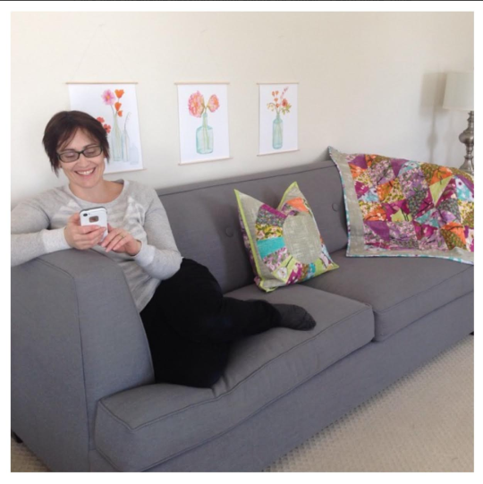 And here is the AH-mazing Laura Gunn chilling on AmyLouWhoSew's couch with just a few of the projects that were made with her Vignette fabric. She is so nice and encouraging. Just love her!